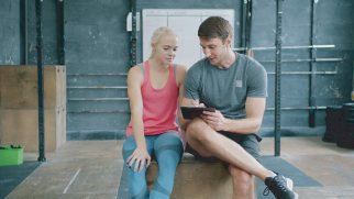 Trainer guiding a member